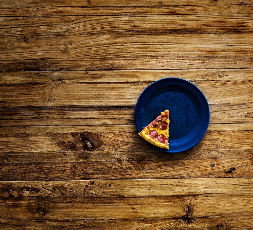 Last Slice of Pizza on Blue Plate
