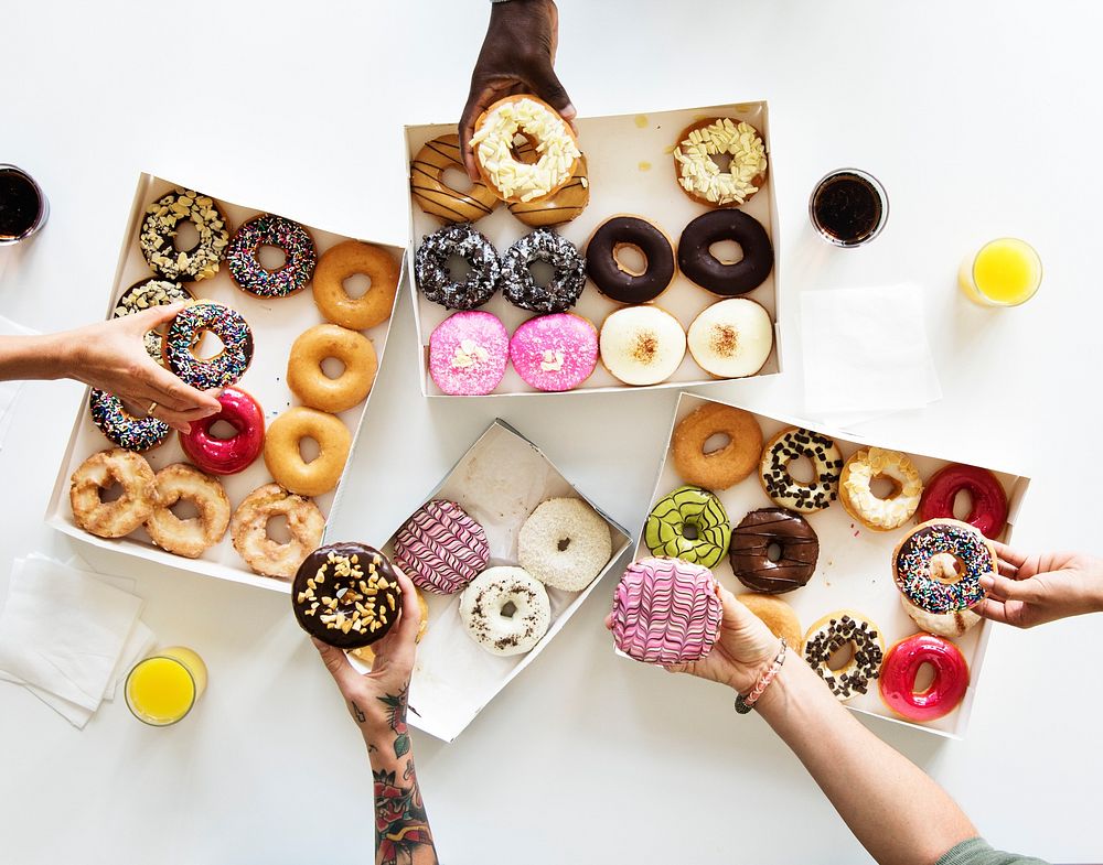 Diversity People Hands Reach for Doughnuts