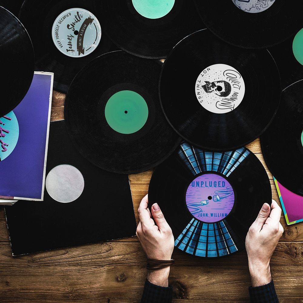 Hands with Vinyl Record Player Music