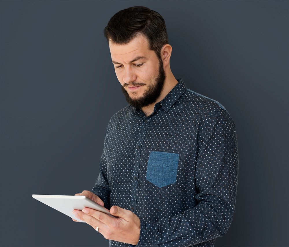 Adult Caucasian Man Using Digital Tablet