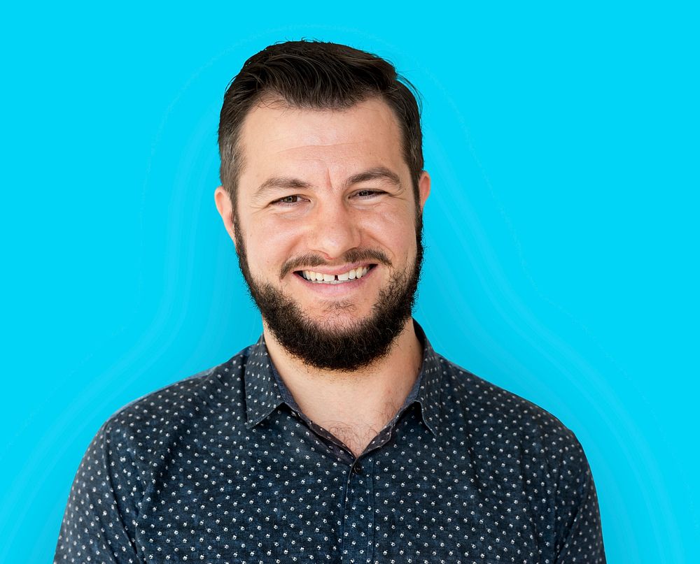 Man standing and smiling for photoshoot