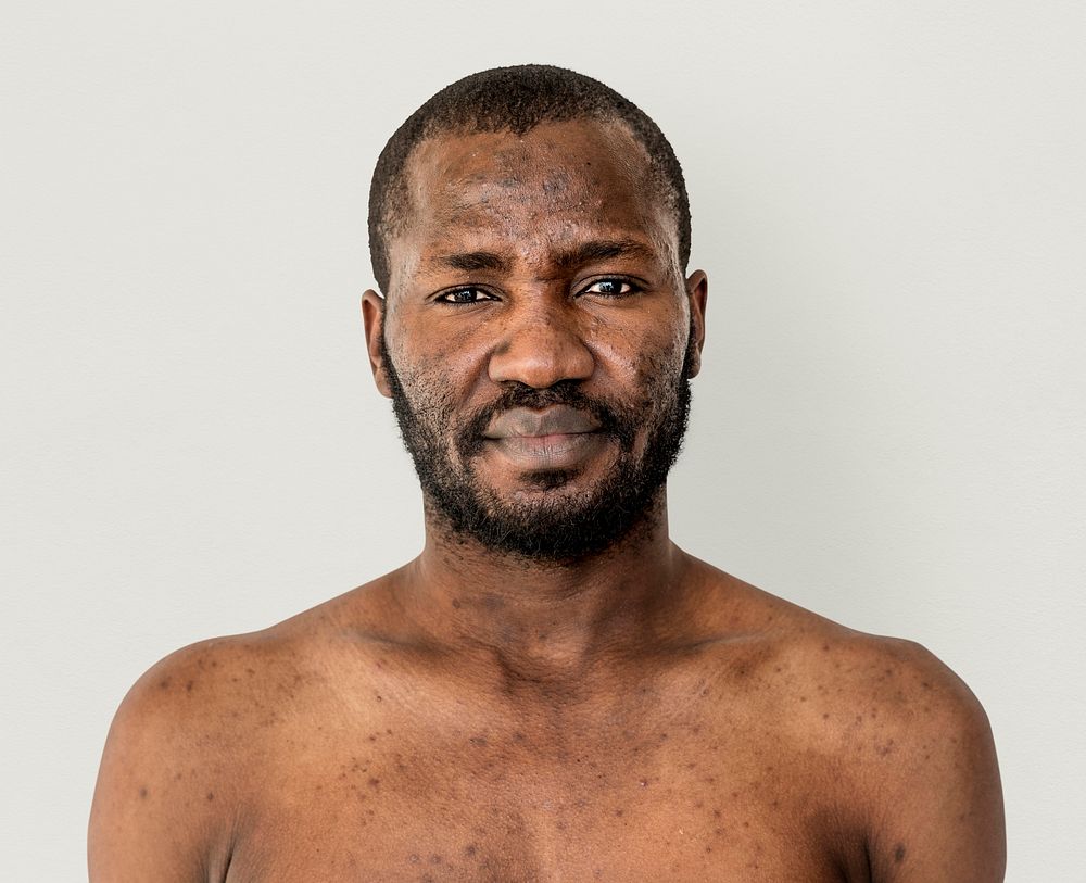 African man mustache bare chest studio portrait