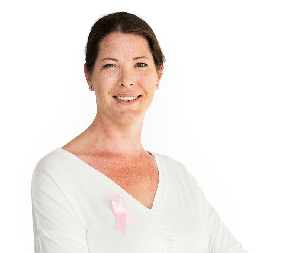 Woman with pink ribbon for breast cancer awareness charity studio portrait