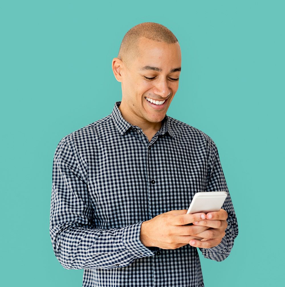 A guy is smiling using smartphone