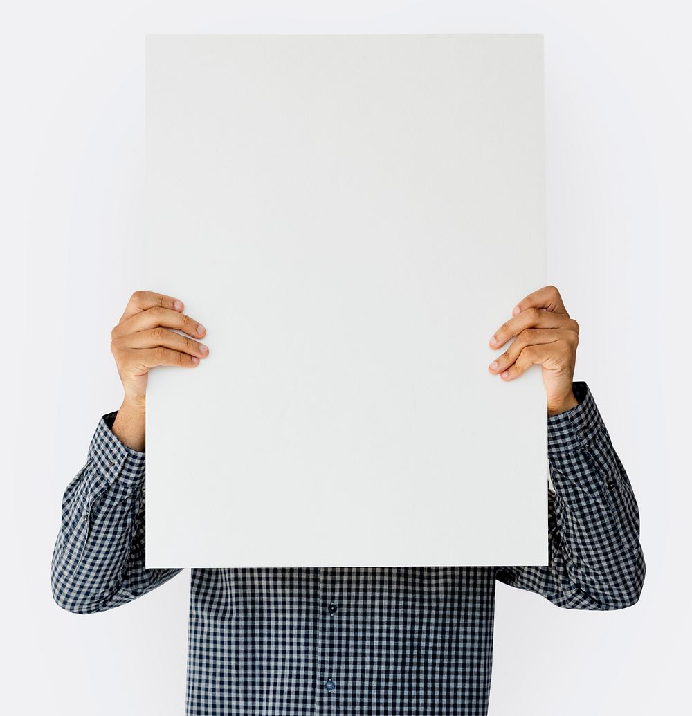 Man holding blank banner cover face studio portrait
