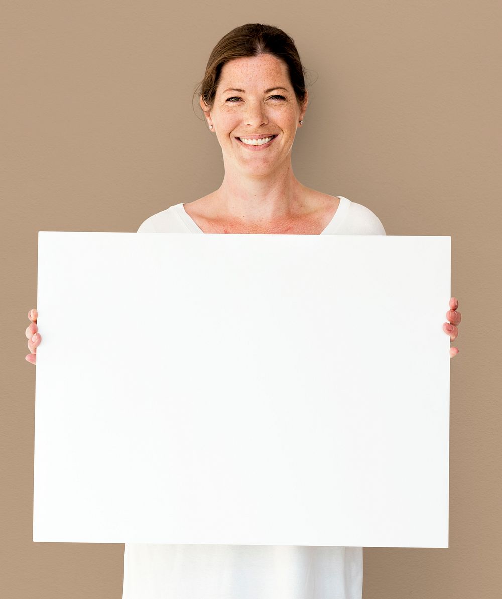 Caucasian Woman is Holding Placard