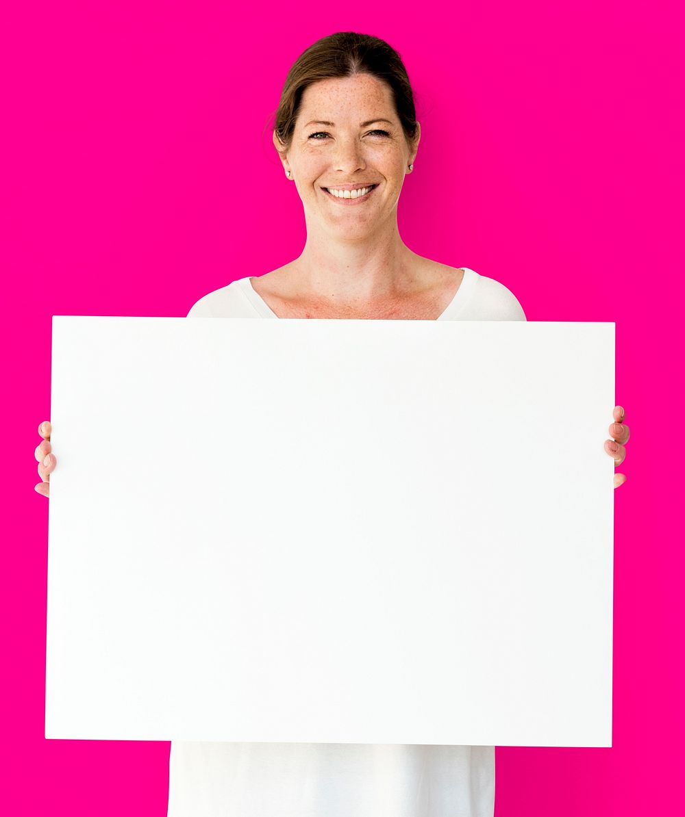 Caucasian Woman is Holding Placard