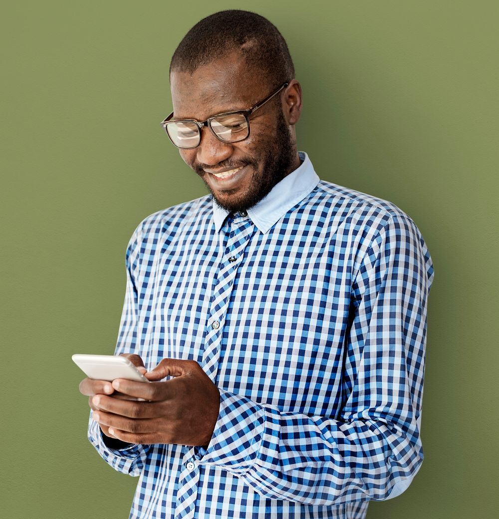 African Descent Guy is Smiling with Smartphone