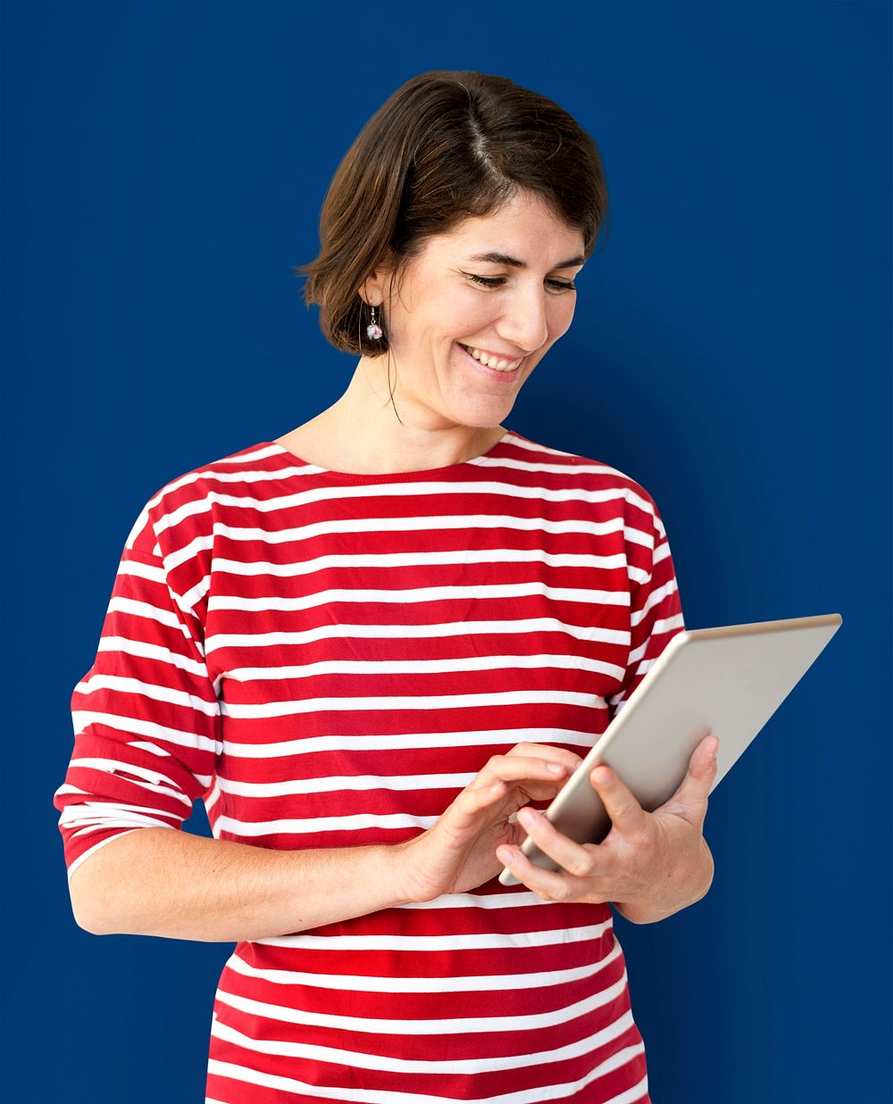 Adult Woman Using Digital Tablet Studio
