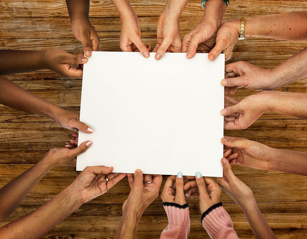 Group of diversity hands holding empty paper