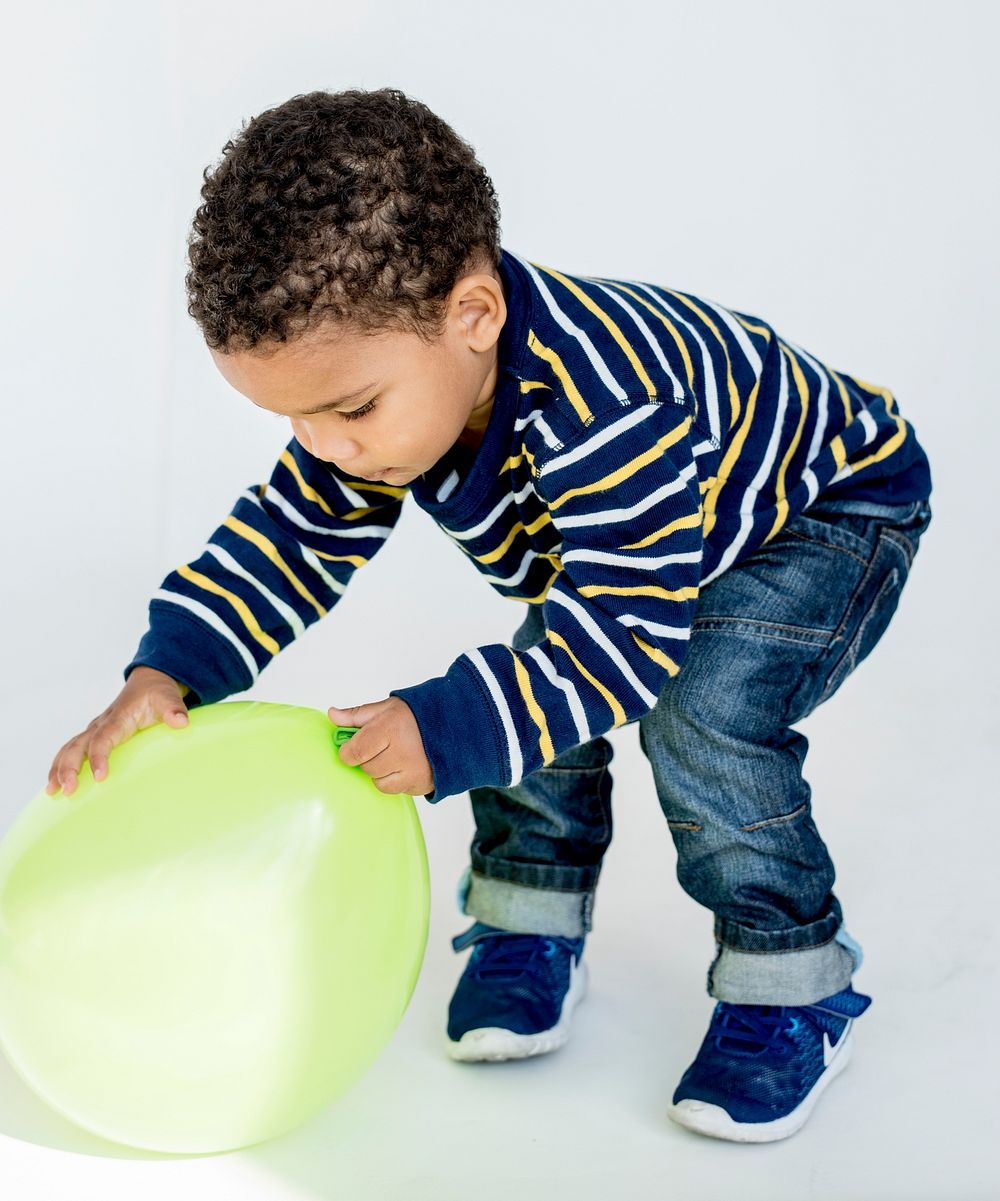 Little Boy and Balloon Playful Studio Portrait