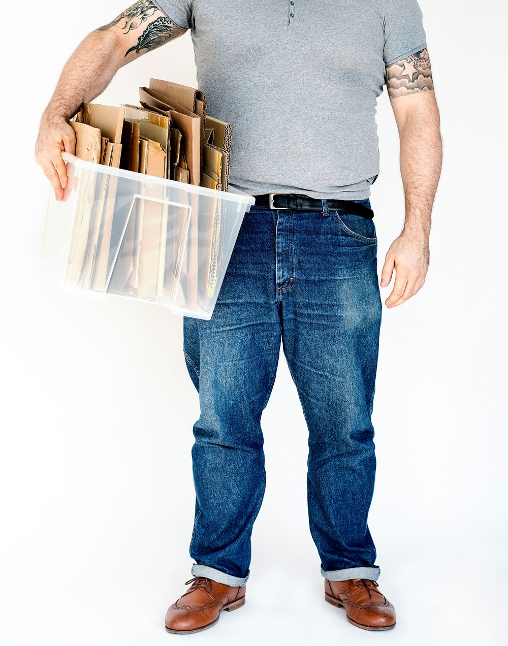 Man standing and holding box of cardboard