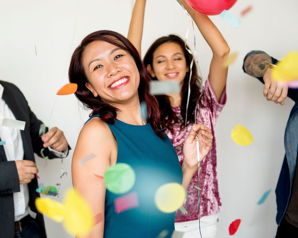 Group of Diverse People with Party Balloons Confetti