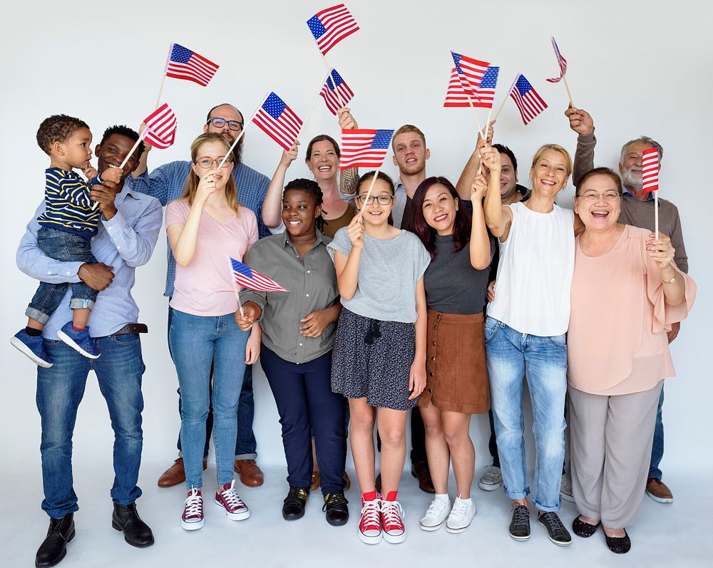 Group of people holding american flag studio portrait