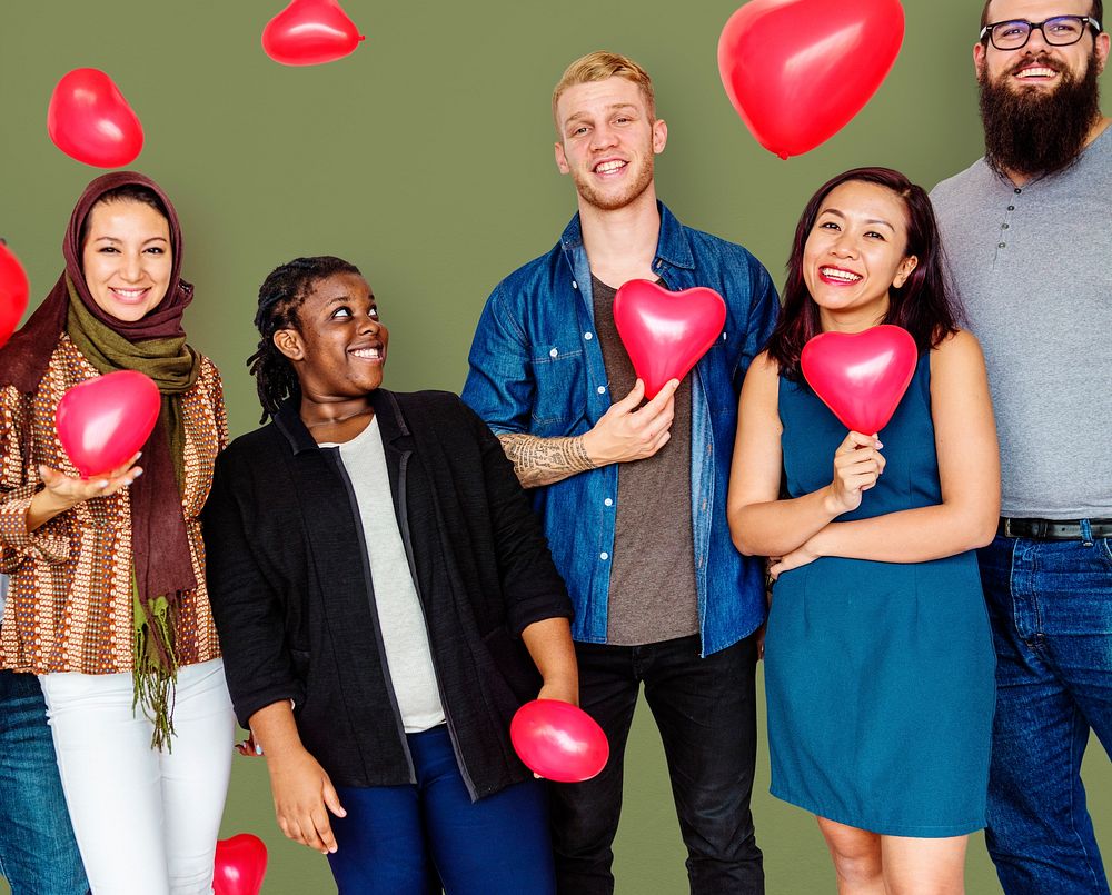 Group of Diverse People Holding Heart Balloons Cheerfully