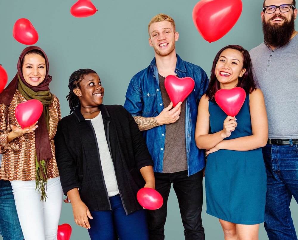 Group of Diverse People Holding Heart Balloons Cheerfully