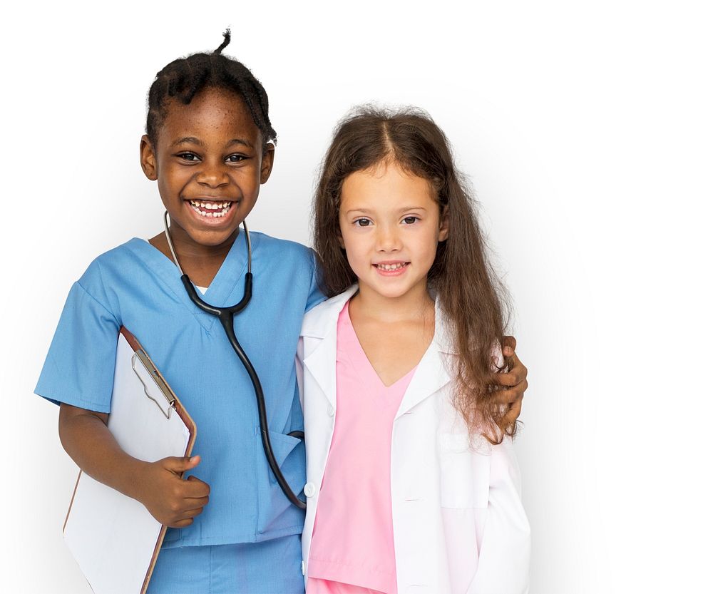 Cheerful diverse kids in medical uniform costumes