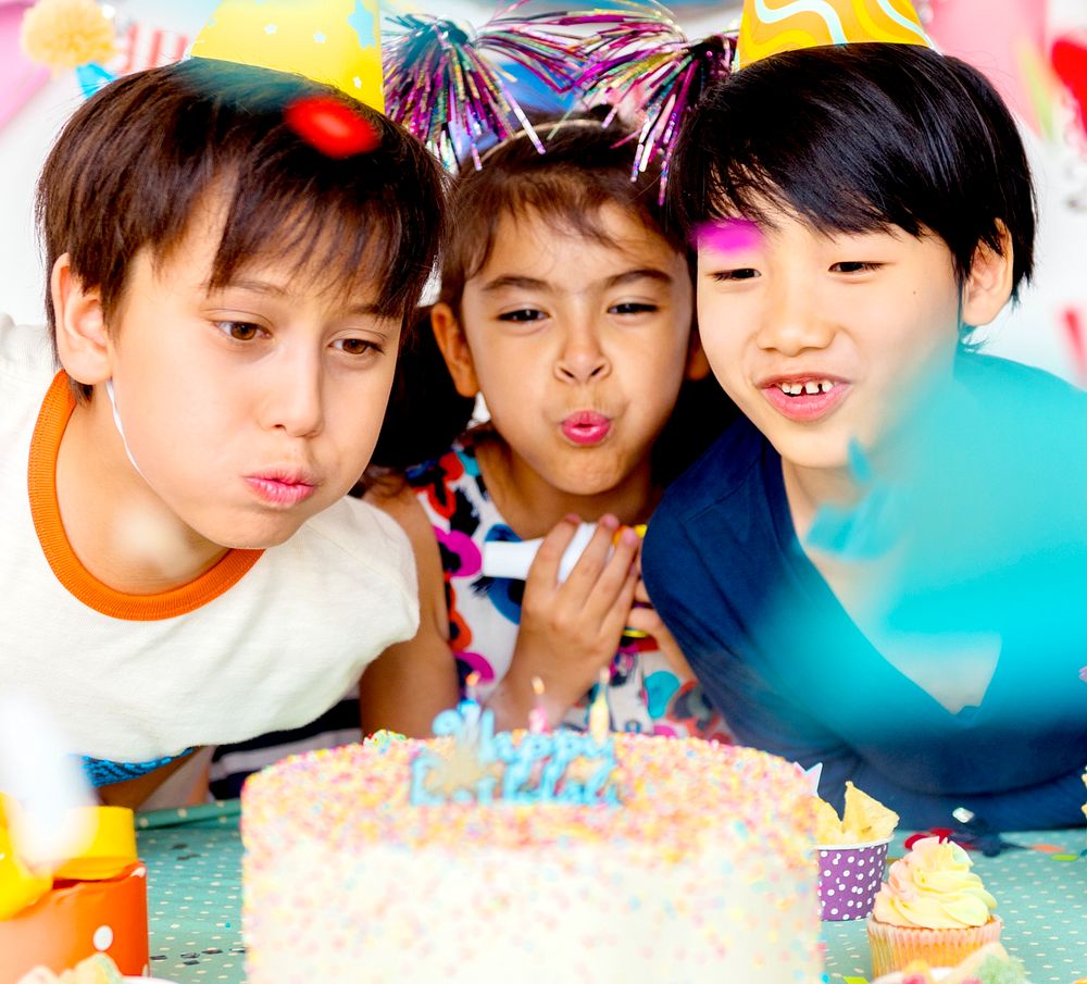 Group of diverse kids enjoying a bithday party