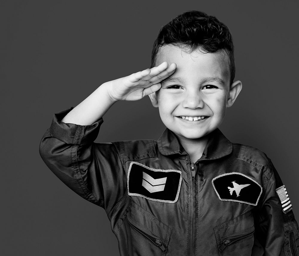 Little boy with pilot dream job salute and smiling