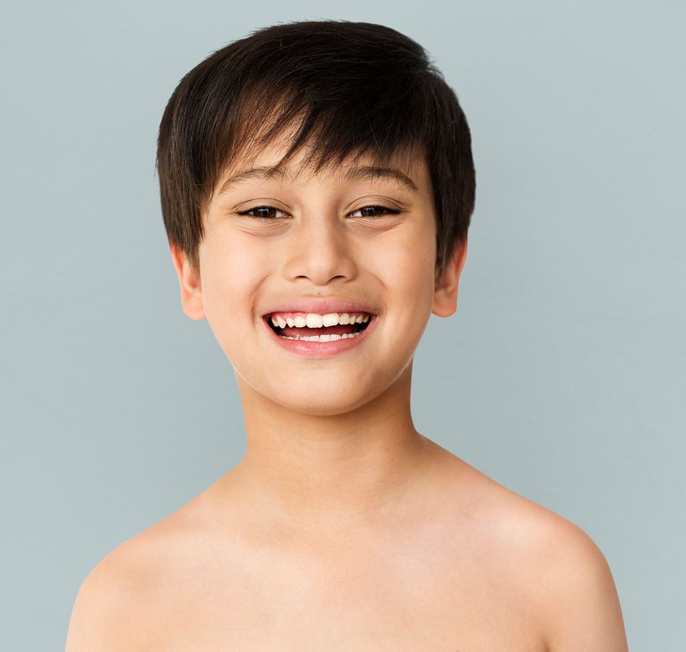 Little Boy Smiling Face Expression Topless Studio Portrait