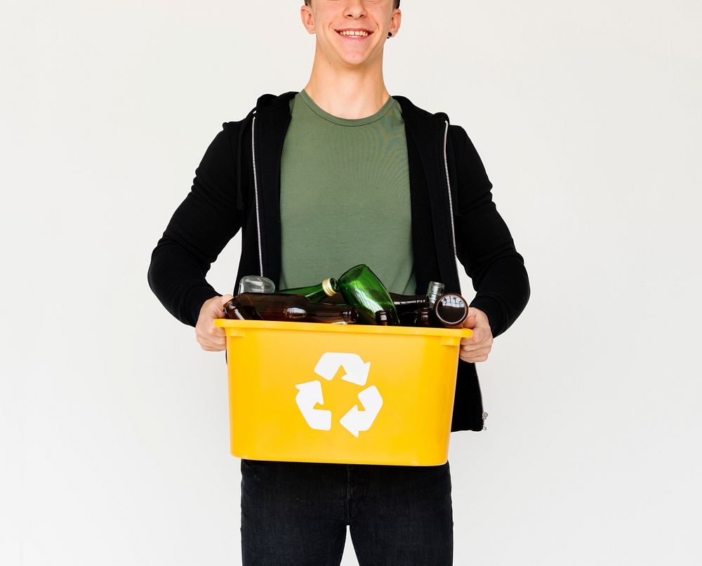 A Teenager Guy is holding a Glass Bottle Trash
