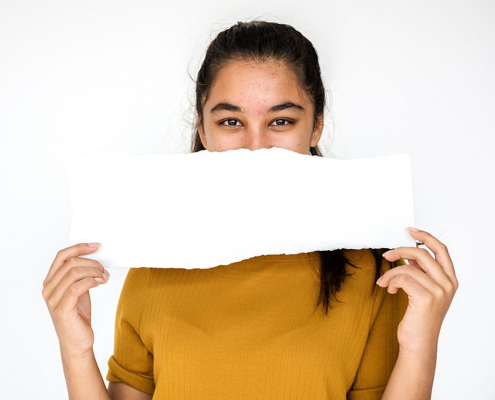Young girl holding empty paper on white background