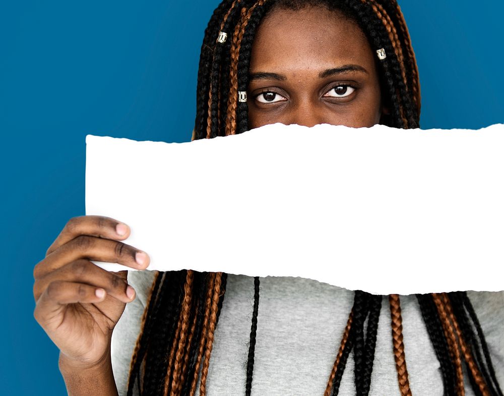 African descent girl is holding a blank paper