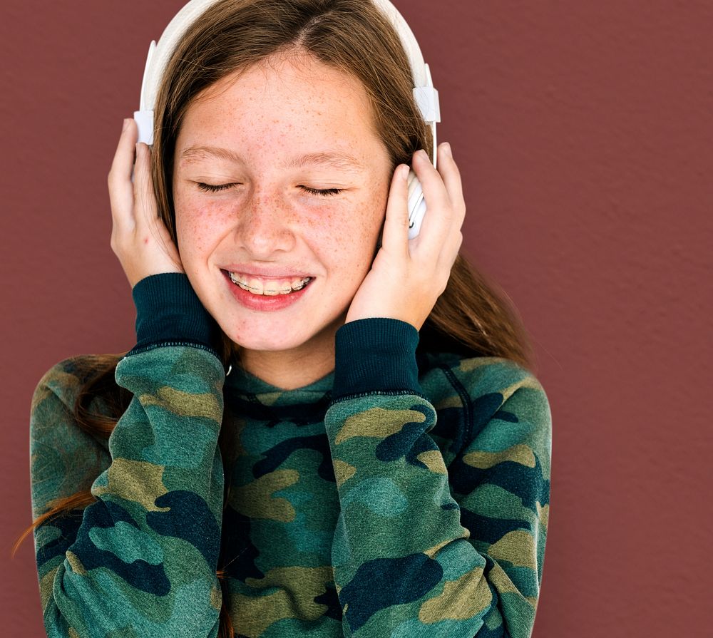 Young caucasian girl with headphone