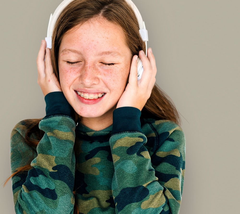 Young caucasian girl with headphone