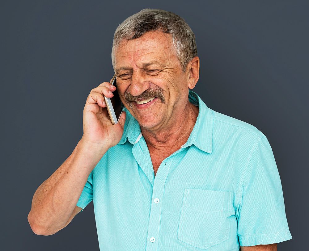 Senior Adult Man Talking on Mobile Phone Studio Portrait