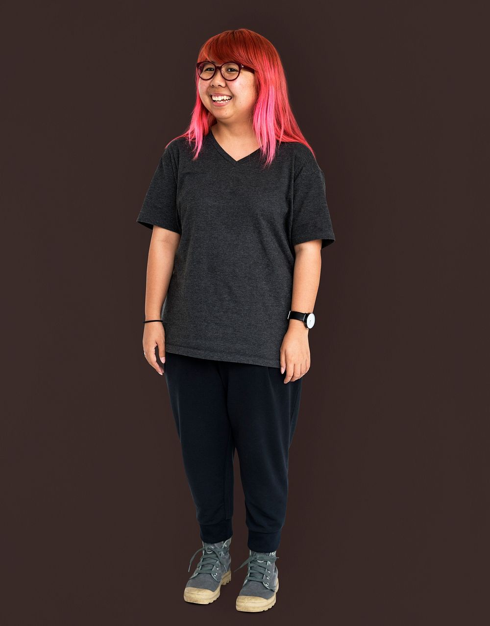 Young adult asian girl standing and smiling studio portrait