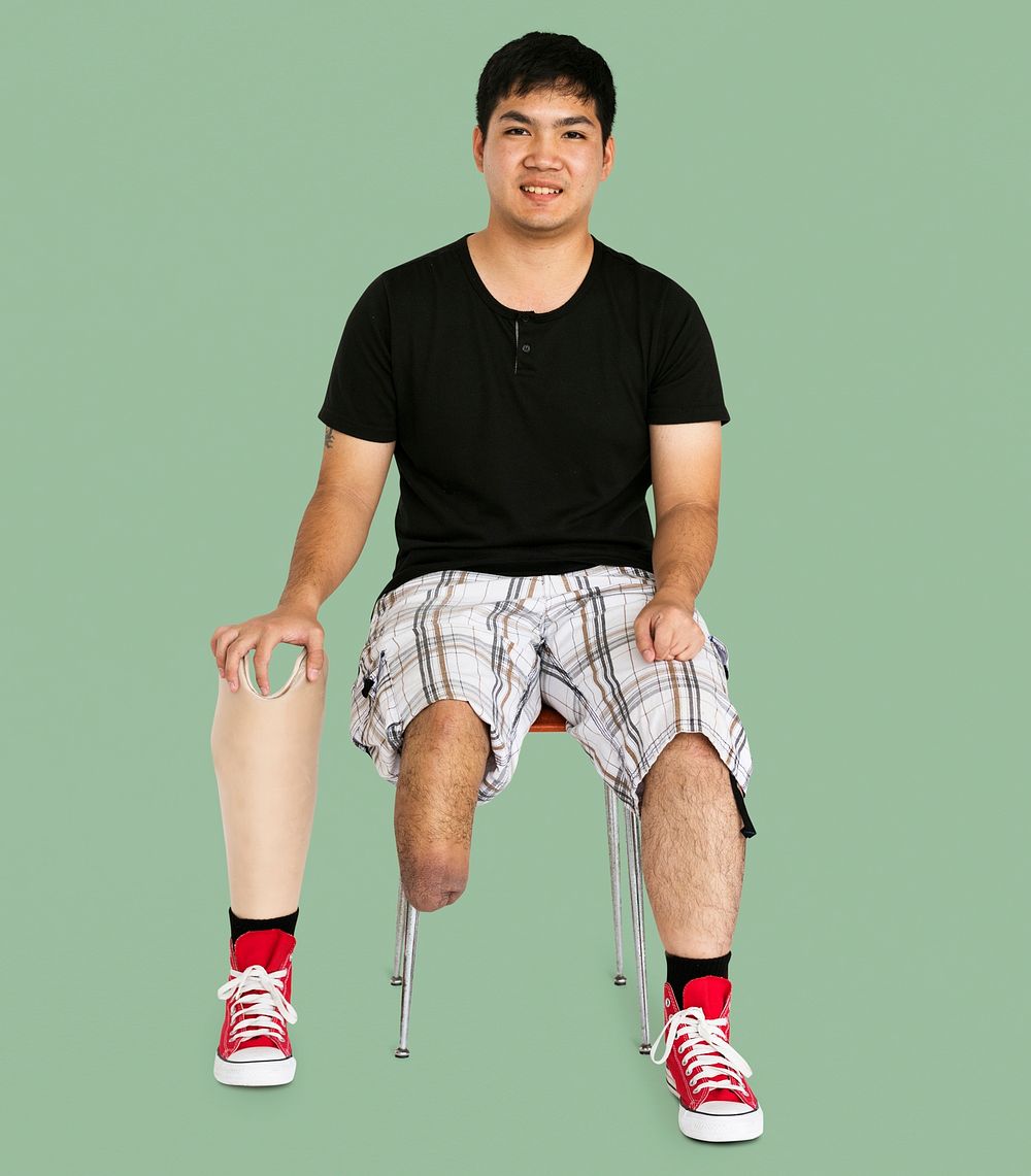 Disability Young Man with Prosthesis Leg Studio Portrait