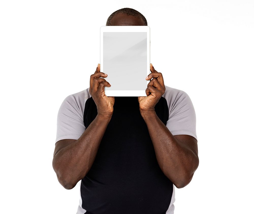 African descent man holding tablet