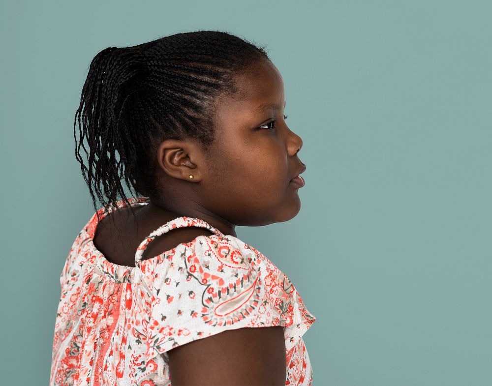 Little african girl casual studio portrait side view