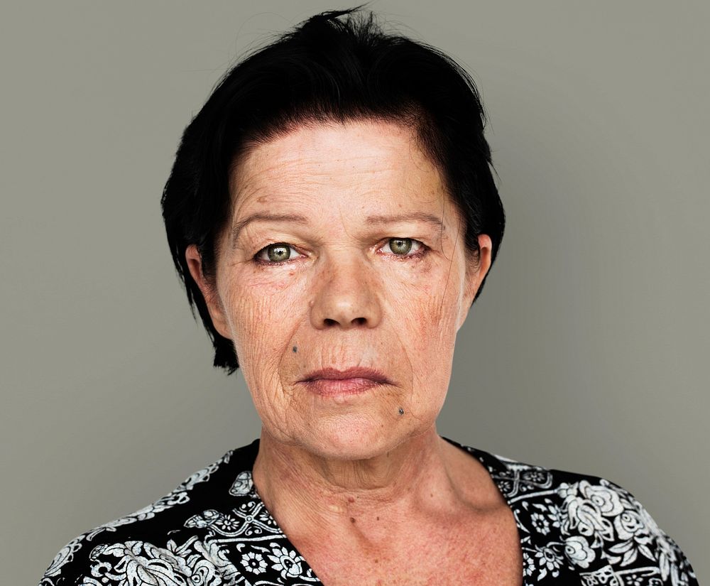 Senior adult woman in moody studio portrait