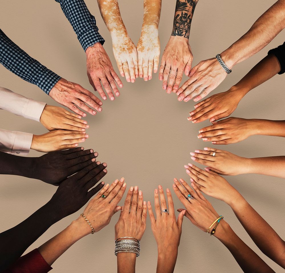 Group of hands assemble together in aerial view