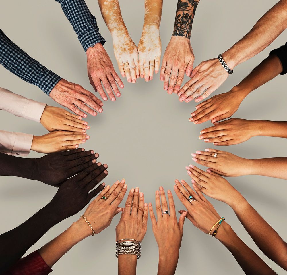 Group of hands assemble together in aerial view