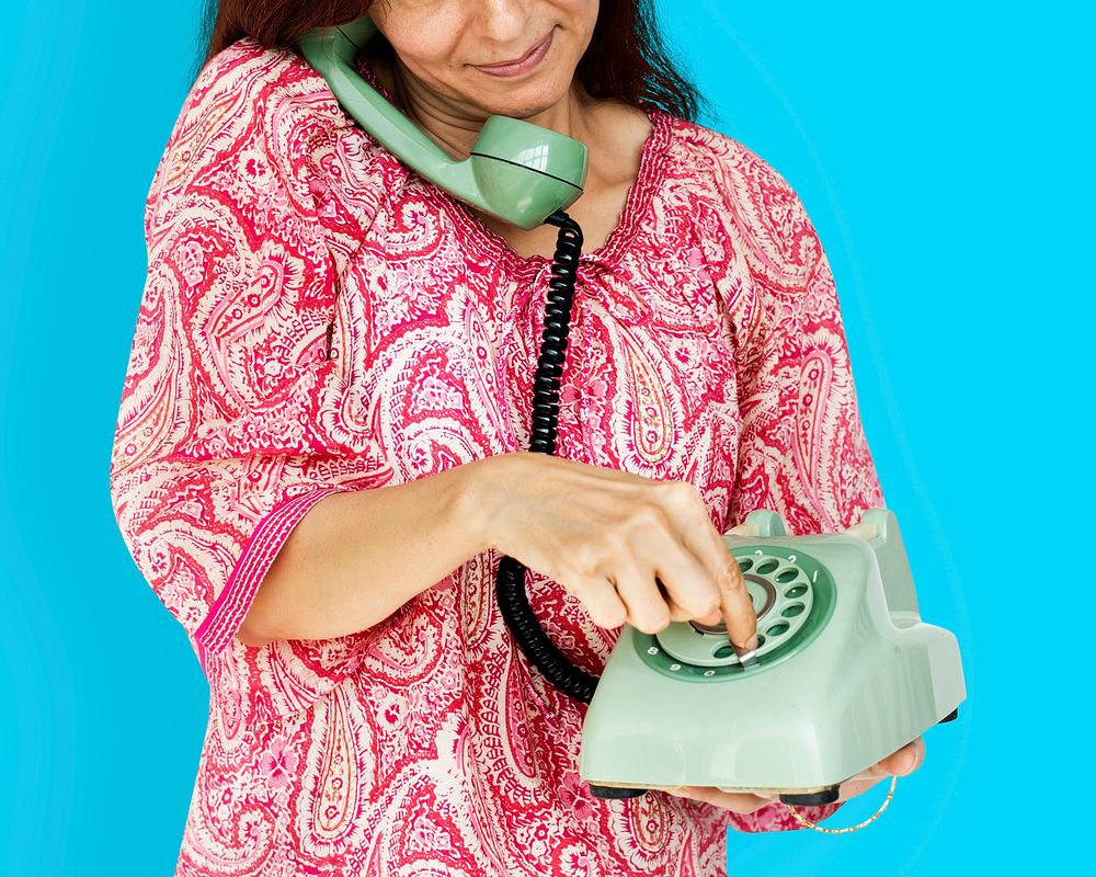 Woman holding and dial telephone communication