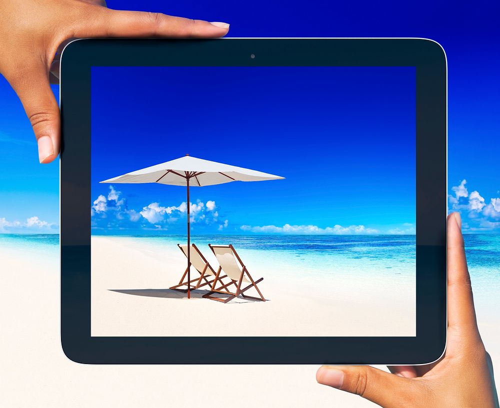 Digital tablet frame at tropical beach.