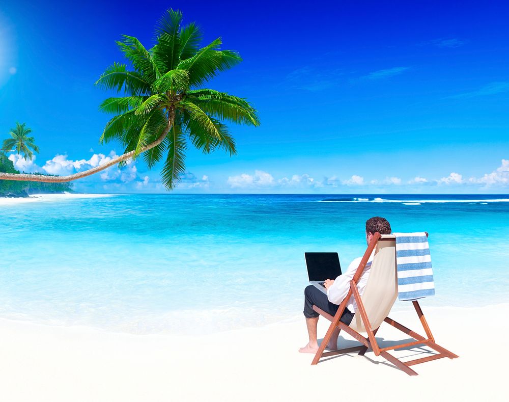 Businessman working on a tropical beach.