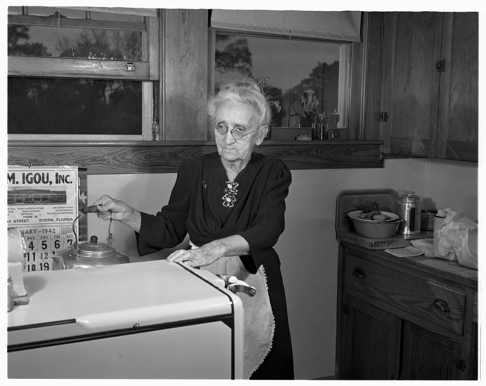De Land pool. La Roe shop. Seventy-five-year-old Mrs. Katie La Roe, great-grandmother of the family, does the cooking for…