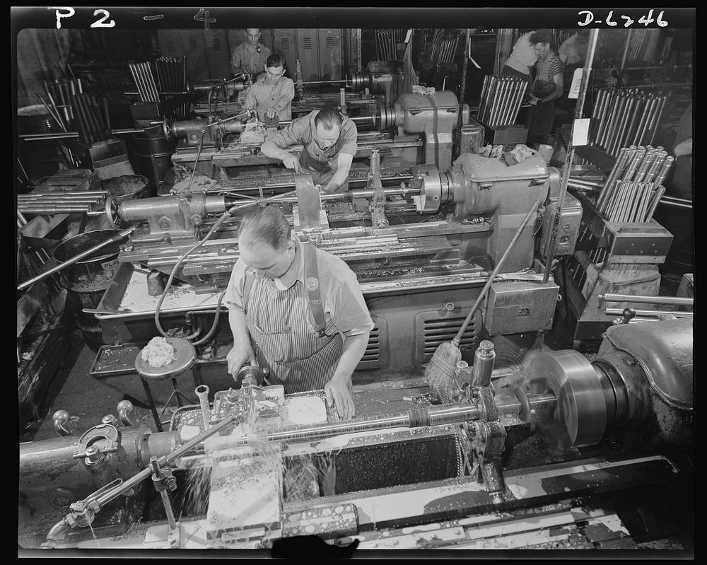 Production. Machine guns of various calibers. High-speed lathe operators in the plant of a large manufacturer of firearms…