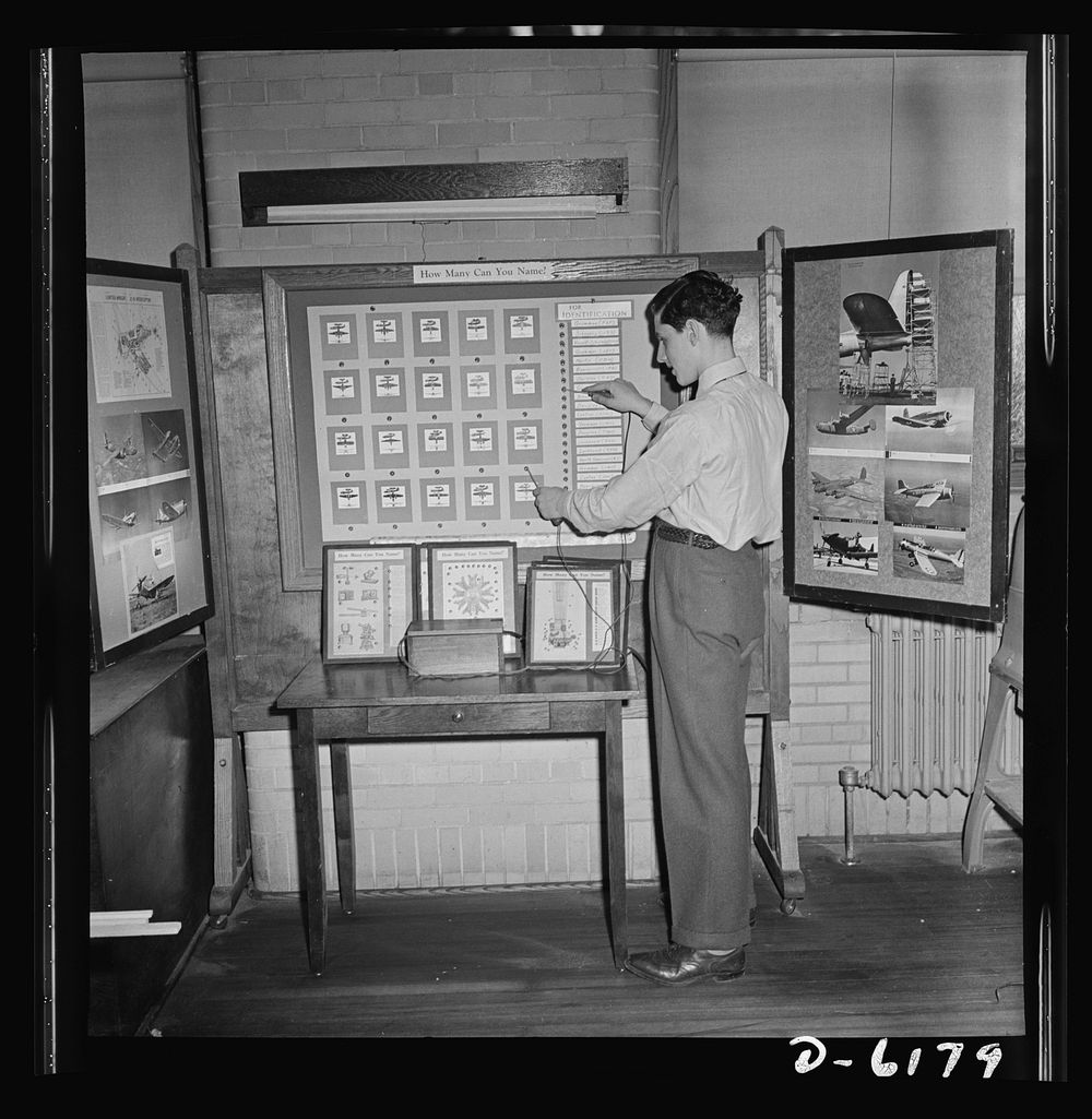 Training high school boys to identify planes. If he makes the right contact, this student of Newark's Weequahic High School…