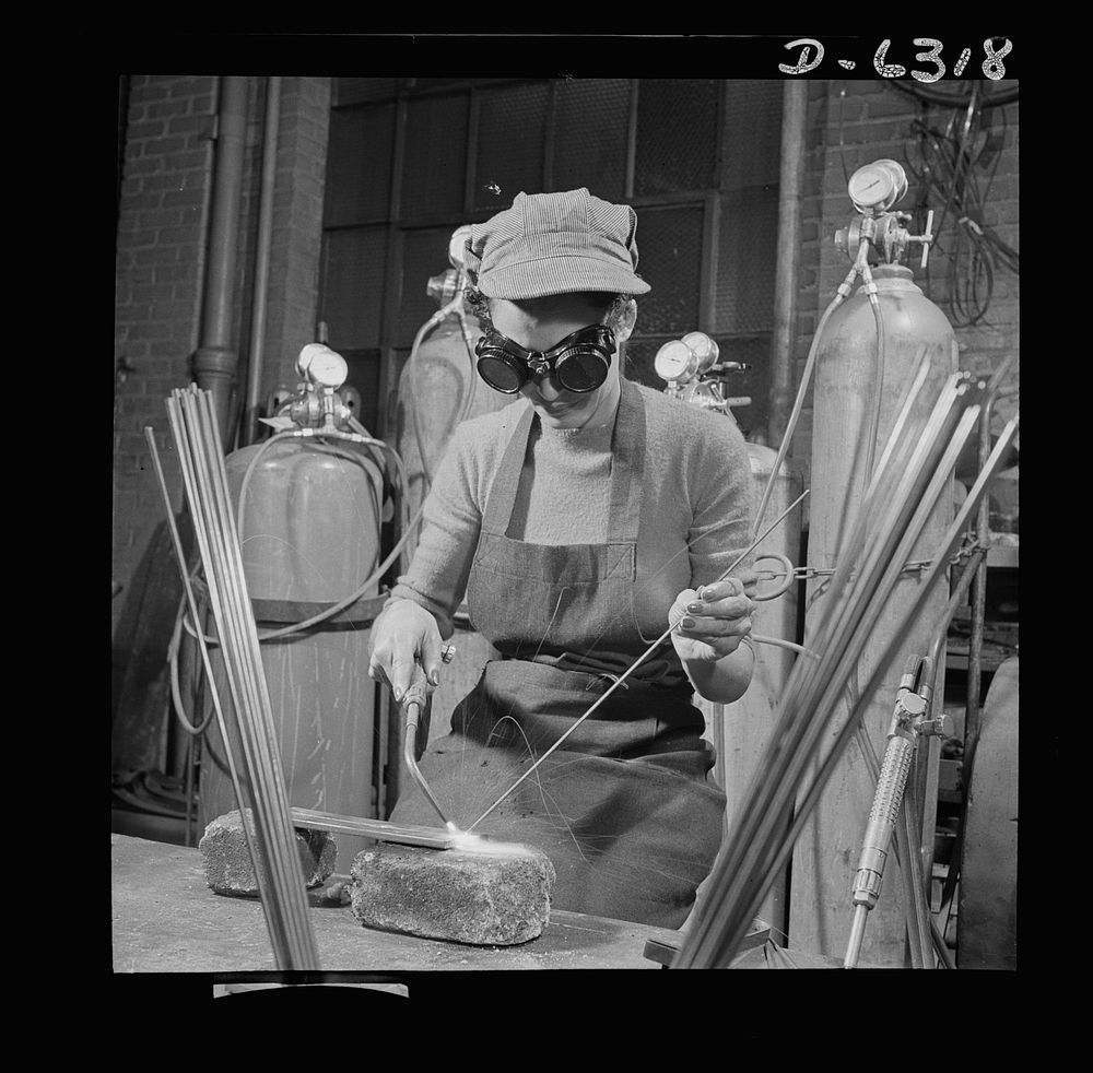 Training. Work Projects Administration (WPA) vocational school. This young lady is training to work on the assembly line of…