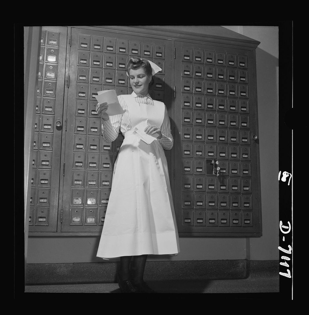 Nurse training. Highlighting a day of intensive training, mail from home brings a smile to this young student nurse's face.…