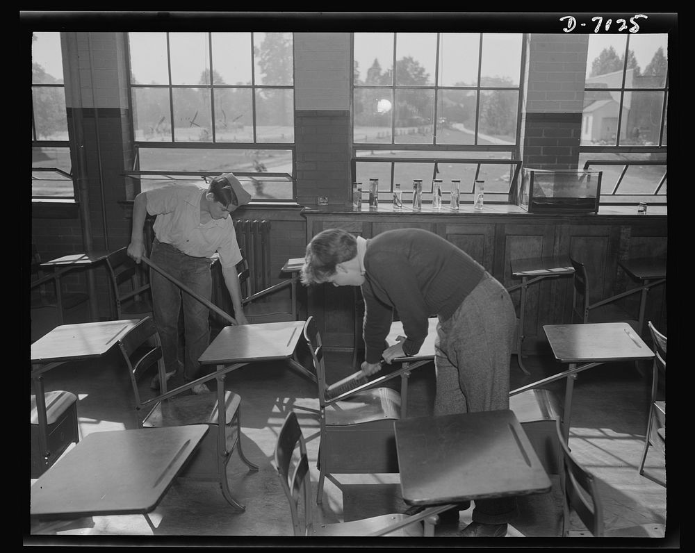 High school Victory Corps. James Parsley and Bill Sabin do their clean-up chores for the day in Montgomery Blair High…