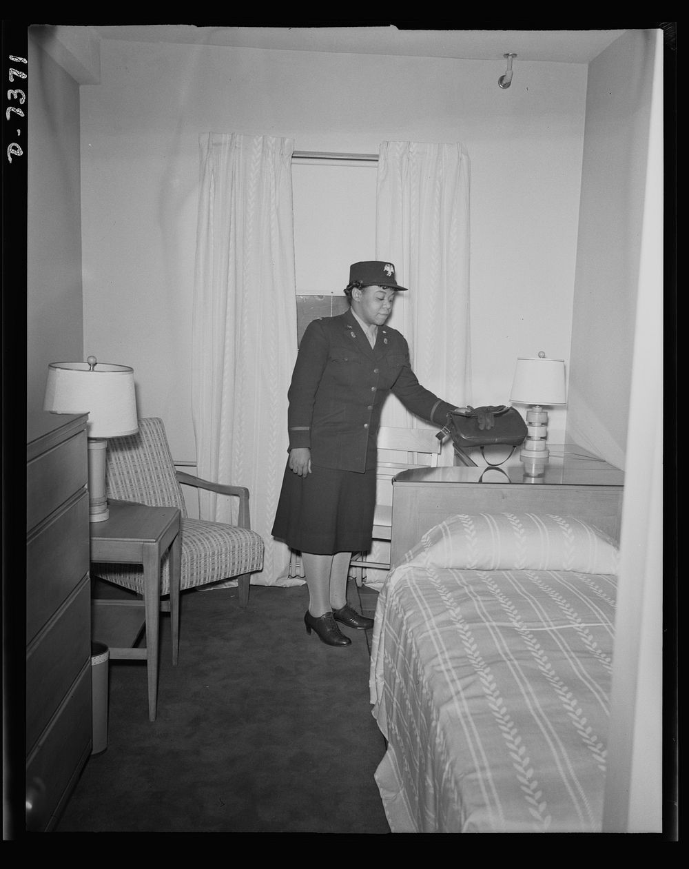Government hotel for African American women war workers. Third officer Ina Mae McFadden of the Women's Army Auxiliary Corp…