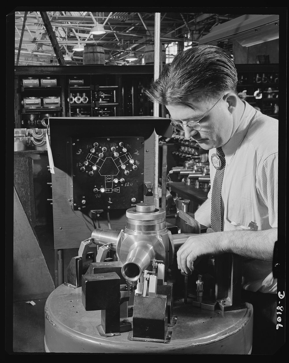 Production. Airplane propellers. Frank Geary uses an electro-limit gauge at a Hartford, Connecticut, plant to make final…