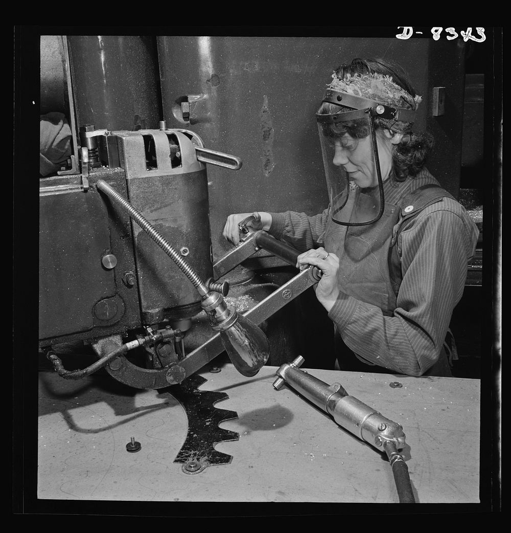 Production. B-17F heavy bomber. Mary Miller, operator of a router at the  Boeing plant in Seattle, drills holes in a part…