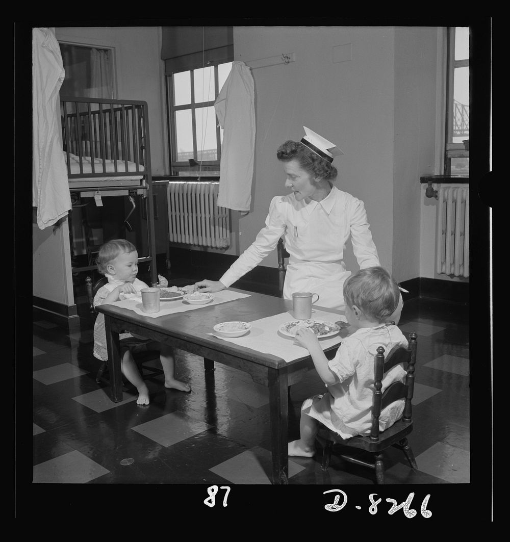 Nurse training. Convalescent children in a hospital are allowed to sit up at a table and eat just as soon as they are able.…